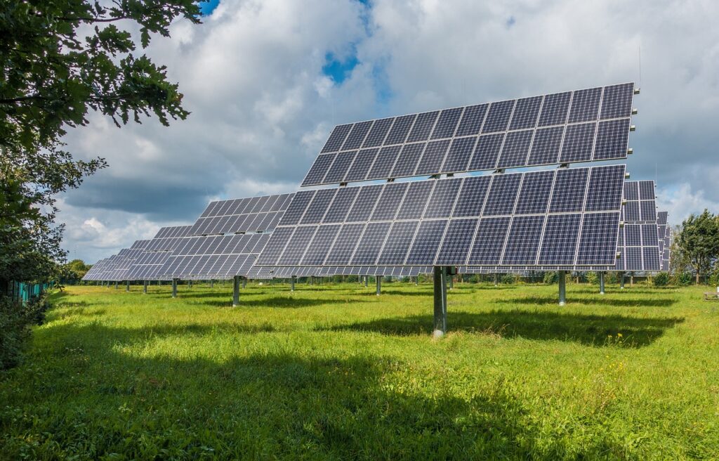 A field with many solar panels on it